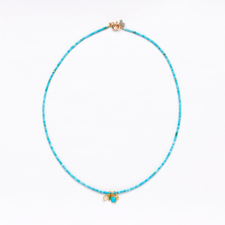 Turquoise and gold charms necklace