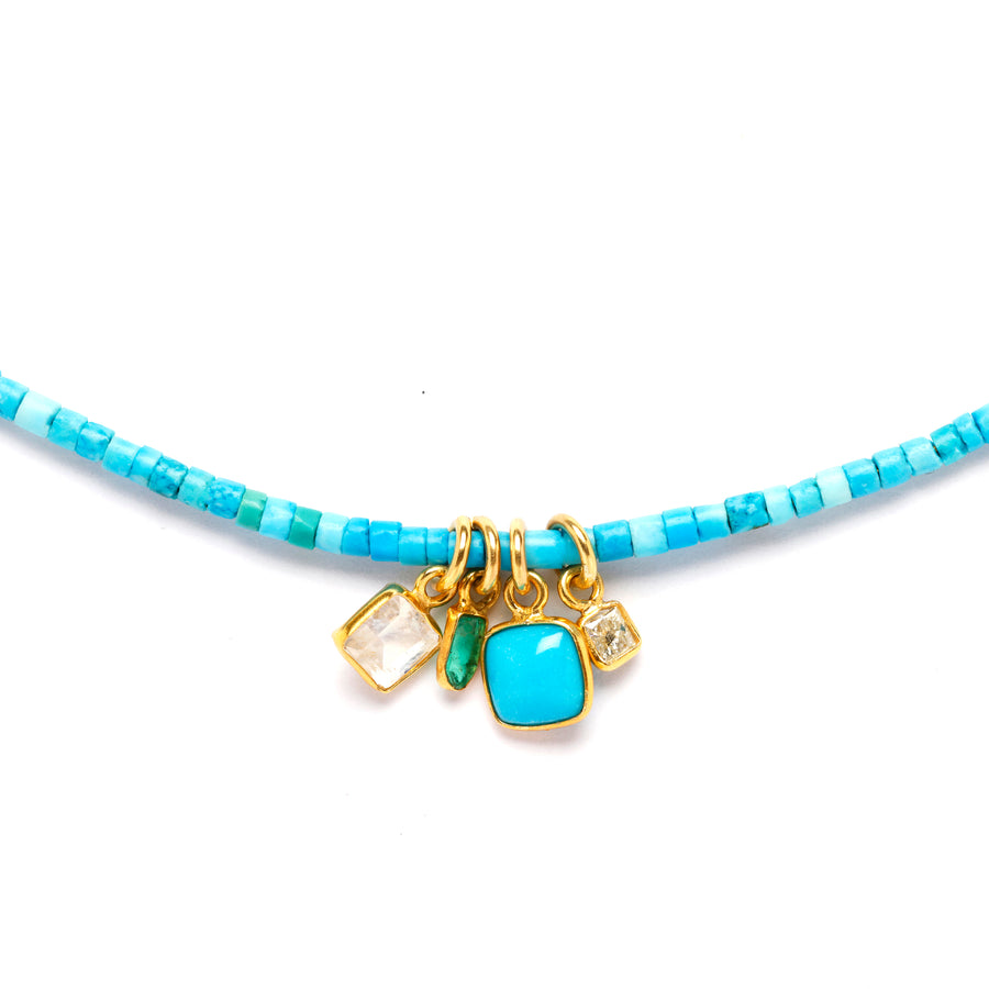 Turquoise and gold charms necklace